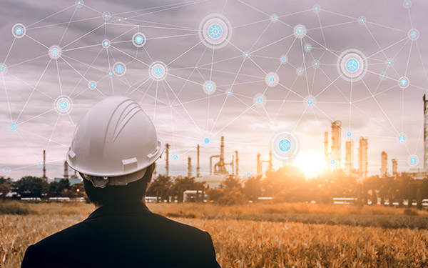 worker looking at industrial plant