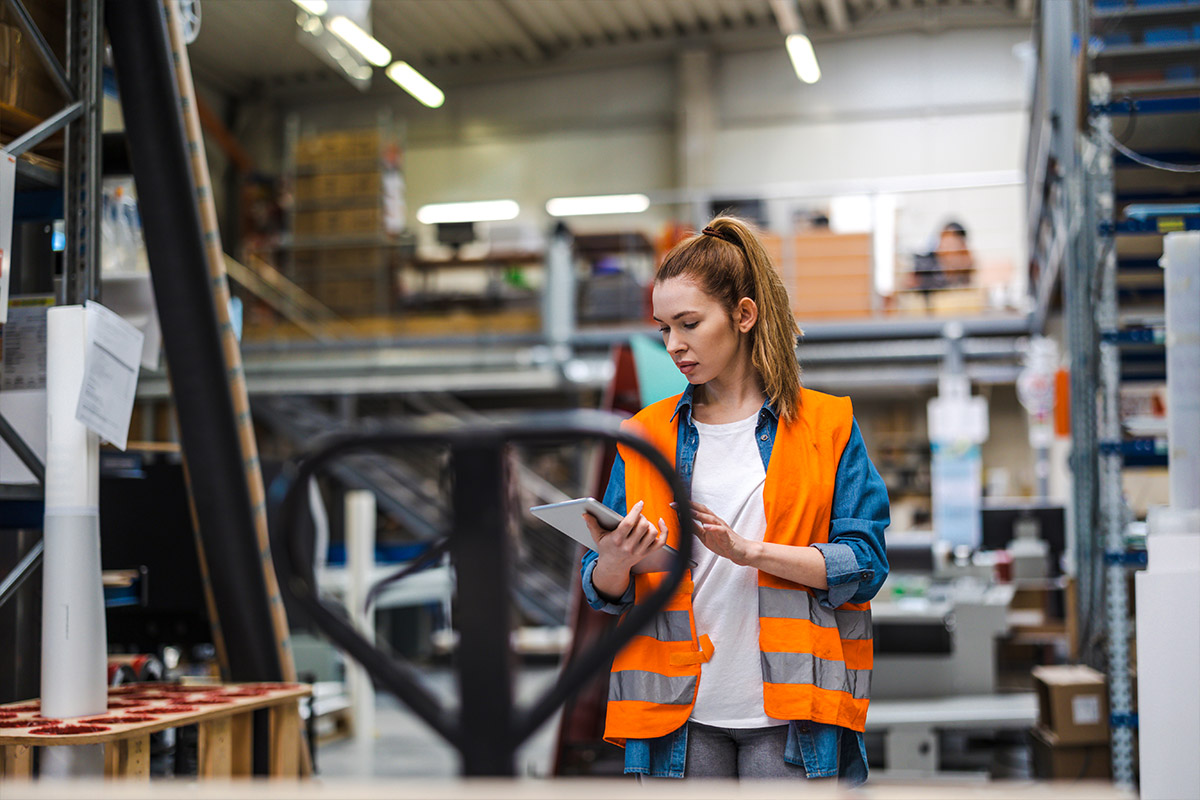 worker taking inventory in warehouse